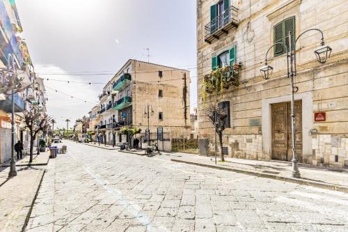 an empty street in an old town with buildings at Bacoli Sveva Luxury House - Terrace & Design in Bacoli