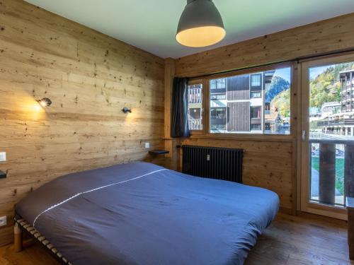 Appartement La Clusaz, 3 pièces, 6 personnes - FR-1-304-224にあるベッド