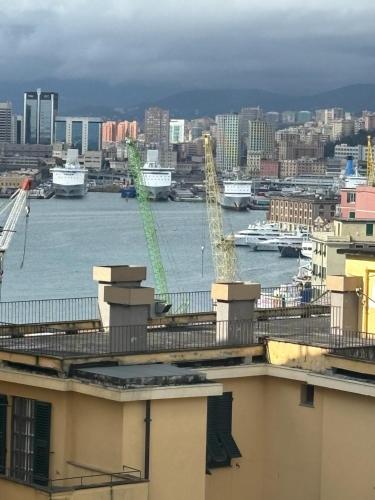 a view of a harbor with boats in the water at LUXURY BASILICA & SEA VIEW 35 - GENOVAINRELAX in Genova