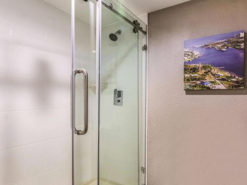 a shower with a glass door in a bathroom at La Quinta Inn by Wyndham Jupiter in Jupiter