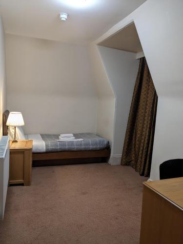 Ένα ή περισσότερα κρεβάτια σε δωμάτιο στο Aberdeen House