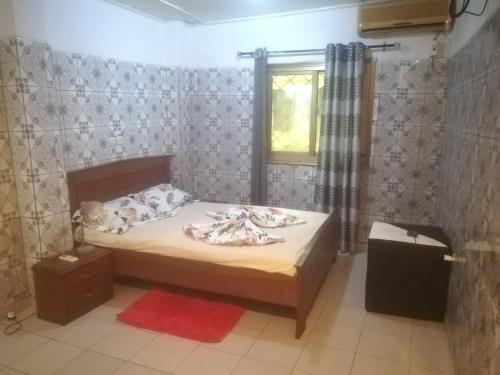 Postel nebo postele na pokoji v ubytování Appartement meublé Douala Bonapriso Savio