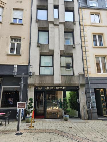 a store front of a building on a city street at CAB Ap'art in Luxembourg