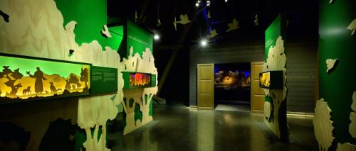 a museum exhibit with a map of the world on a wall at Kloster Bonlanden in Berkheim