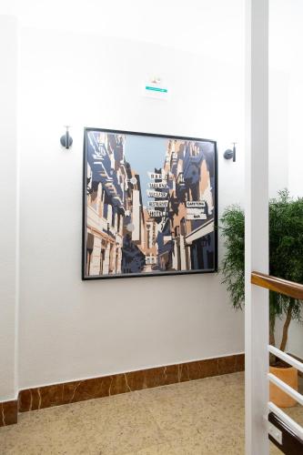 a flat screen tv hanging on a wall at Hotel Alkazar in Valencia