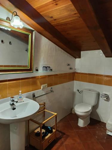 a bathroom with a sink and a toilet at Turismo Rural Calaliu in Peratallada