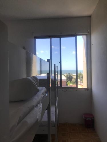 Ένα ή περισσότερα κρεβάτια σε δωμάτιο στο Sossego da Lana