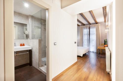 a bathroom with a sink and a mirror at Hostal Pichorradicas in Tudela