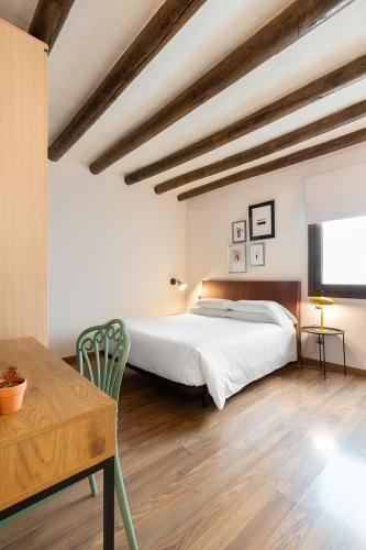Ένα ή περισσότερα κρεβάτια σε δωμάτιο στο Hostal Pichorradicas