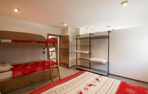a room with two bunk beds and a rug at Amazing Home In Castello Tesino With House A Mountain View in Castello Tesino