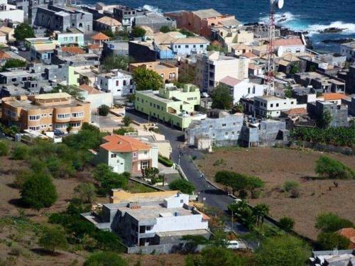 an aerial view of a city with houses and the ocean at Pensão Restaurante Christine & Irmãos in Igreja