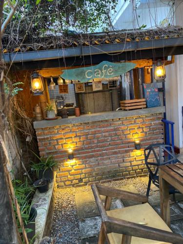 a brick building with a cafe sign on it at Seconds Hostel - Colombo in Colombo