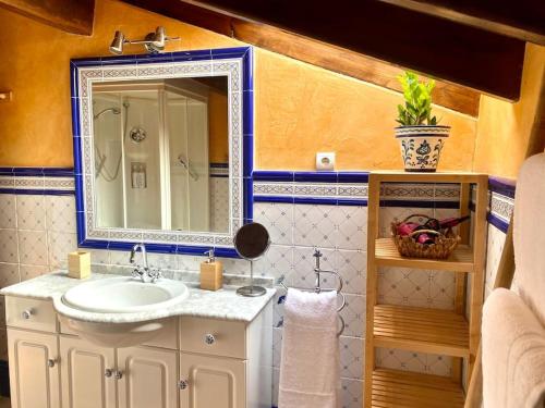 a bathroom with a sink and a mirror at BILBO Near ático rural con terraza in Basauri