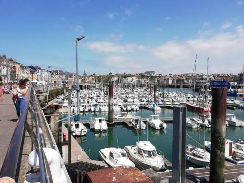 a group of boats docked in a harbor at Au coeur de Dieppe, au puits salé BY HOLIDIEPPE in Dieppe