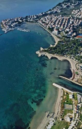 an aerial view of a beach and the ocean at Split/Podstrana Apartment ADRIA in Podstrana