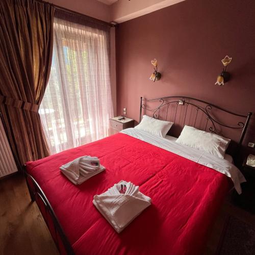 Ένα ή περισσότερα κρεβάτια σε δωμάτιο στο Guesthouse Kastania Korakis