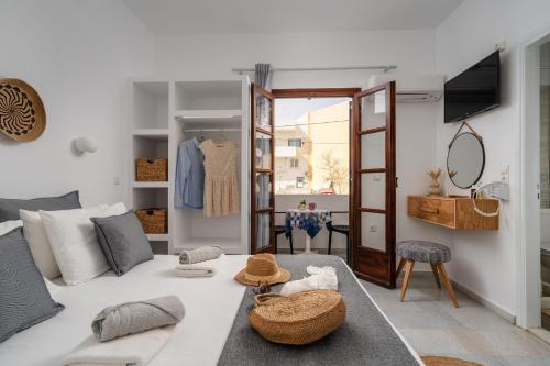 a living room with a bed and a table at Katerina Studios in Naxos Chora