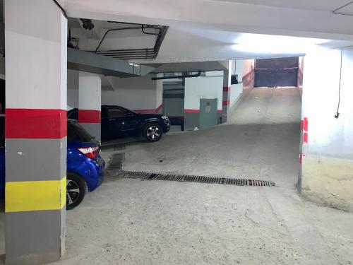 a parking garage with a car parked in it at Elegant and Panoramic 3-Bedroom in Central Tangier in Tangier