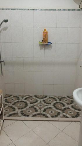 a bathroom with a shower with a tile floor at Casa Tota in Assomada