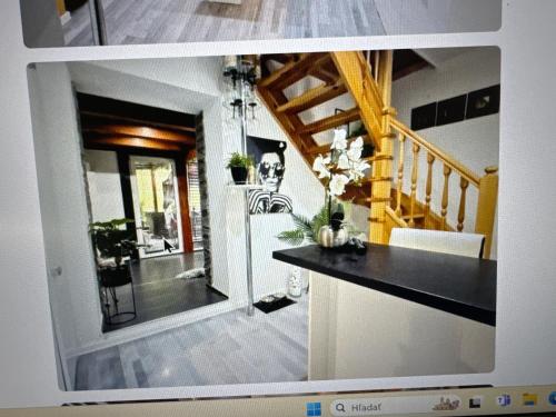 a view of a living room with a staircase at Vykendovy dom in Hontianske Nemce