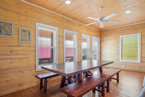 a dining room with a table and windows at Tequila Sunrise in Port Aransas