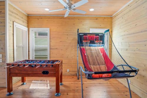 a gym with a basketball hoop in a room at Tequila Sunrise in Port Aransas