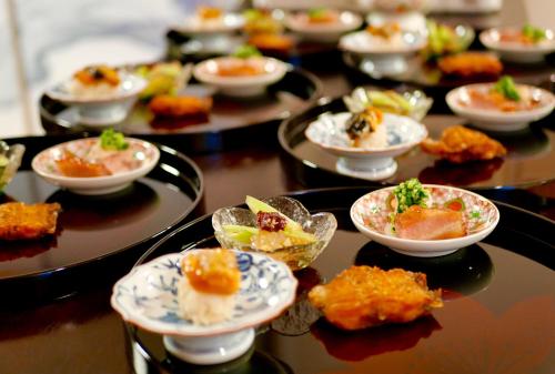 a group of plates of food on a table at Grand Maison W 館山美食倶楽部 in Tateyama