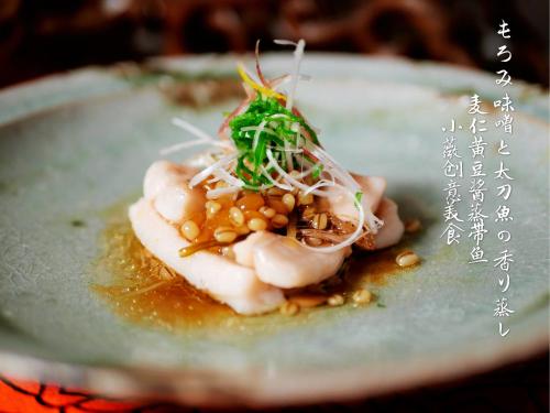a plate of food with seafood and vegetables on it at Grand Maison W 館山美食倶楽部 in Tateyama