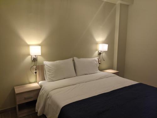 Ένα ή περισσότερα κρεβάτια σε δωμάτιο στο Aristo Central Apartments