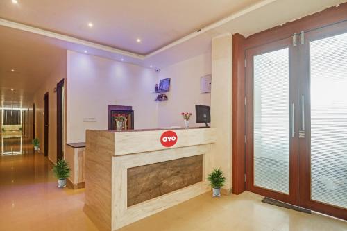 a living room with a fireplace with a stop sign on it at Super OYO Hotel 7 Hills Luxury Rooms in Hyderabad