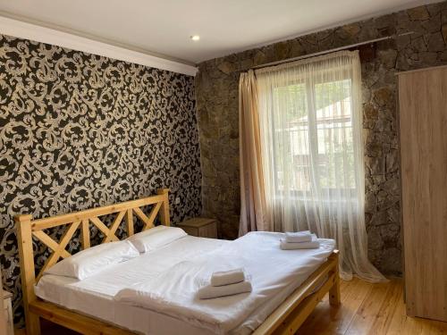 Llit o llits en una habitació de Jelini Villa