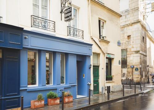 a blue building on the side of a street at Hôtel Bonne Nouvelle in Paris