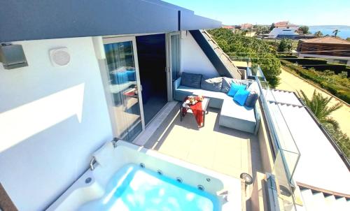 an overhead view of a balcony with a swimming pool at Mavi Panorama Villa in Cesme