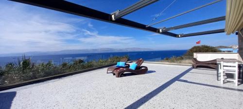 a house with a view of the ocean at Mavi Panorama Villa in Cesme