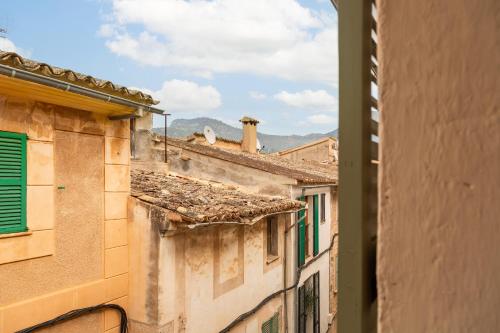a view from an alley between two buildings at SólleRooms in Sóller