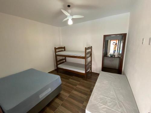 Ένα ή περισσότερα κρεβάτια σε δωμάτιο στο Rancho Chega Mais 3