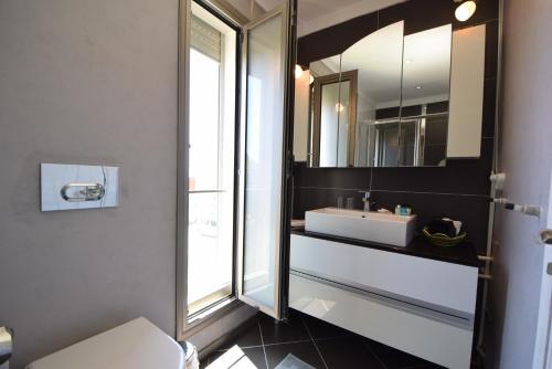 a bathroom with a sink and a mirror at Mavi Panorama Villa in Cesme