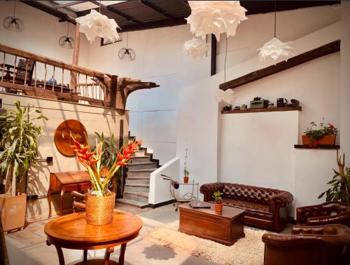 a living room with a couch and a table at Hotel Quinta Bolivar in Bogotá