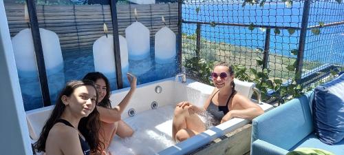 a group of women sitting in a bath tub at Mavi Panorama Villa in Cesme