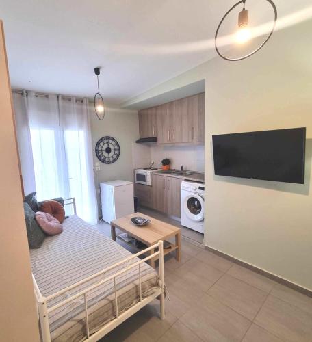 a small living room with a couch and a table at the heart of Heraklion in Heraklio