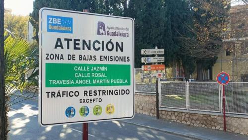 a sign on the side of a street at Apartamento Turistico Dct. Creus in Guadalajara