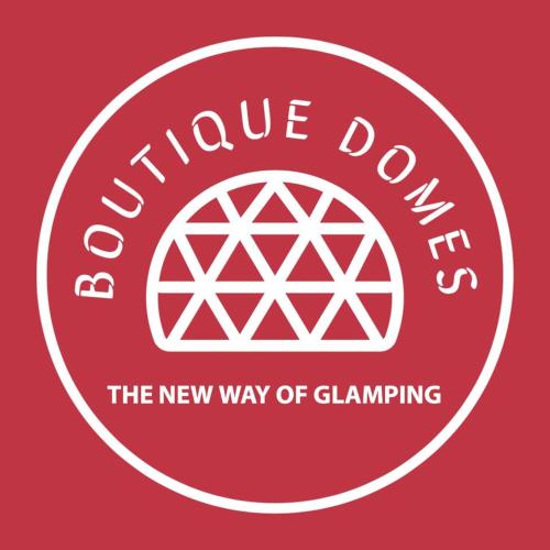 a red sign with a white circle with the words continue down at Glamping Domes in Articlave