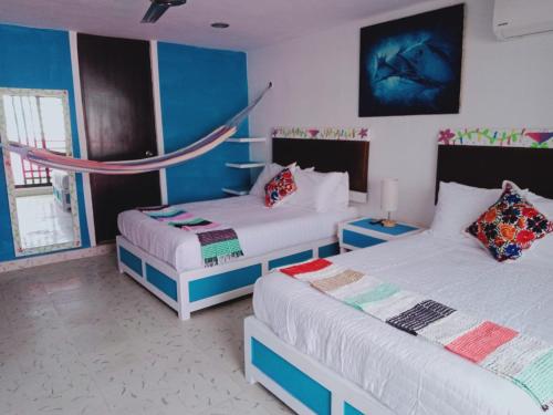 Postel nebo postele na pokoji v ubytování T´úubul K´iin Bed & Breakfast