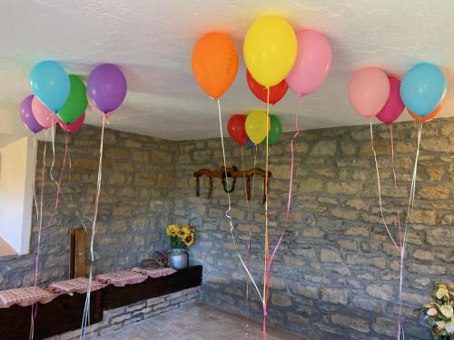 a bunch of balloons hanging from a ceiling at Casa di campagna in Marola