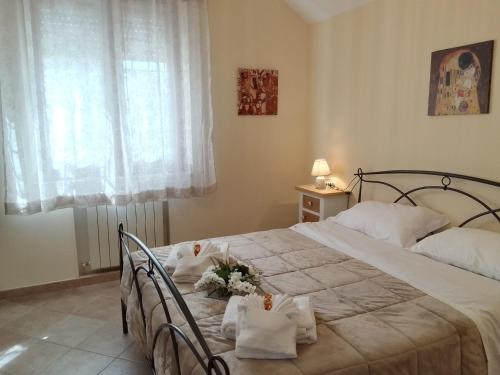 Łóżko lub łóżka w pokoju w obiekcie A casa di Iole