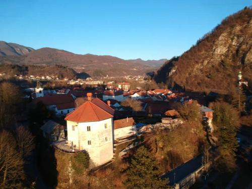 an aerial view of a small village on a hill at Medieval Castle in Kamnik City Center - Trutzturn in Kamnik