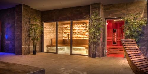 a room with a glass door with plants in it at The Quay Hotel and Spa in Conwy
