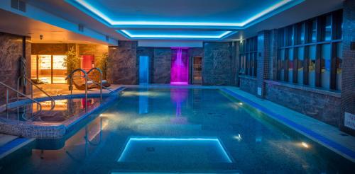 a swimming pool in a house at The Quay Hotel and Spa in Conwy