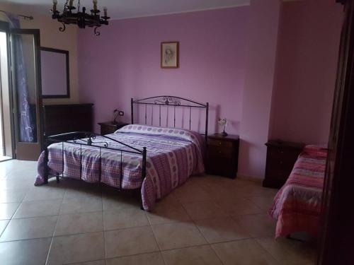 Ένα ή περισσότερα κρεβάτια σε δωμάτιο στο B&B Ippocampo
