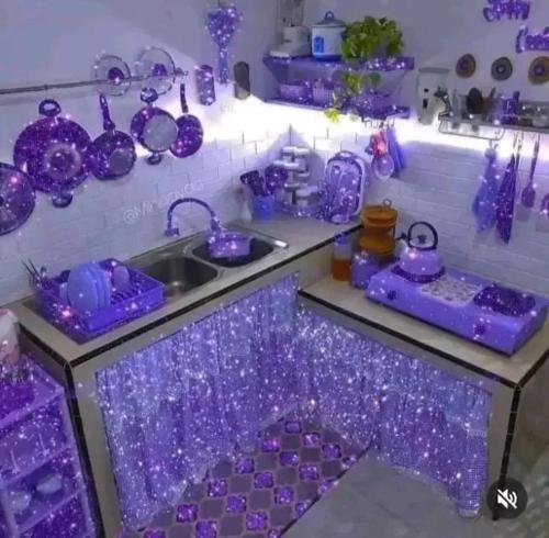 a purple kitchen with a sink and a counter with lights at Ketama ketama ketama in Tlata Ketama